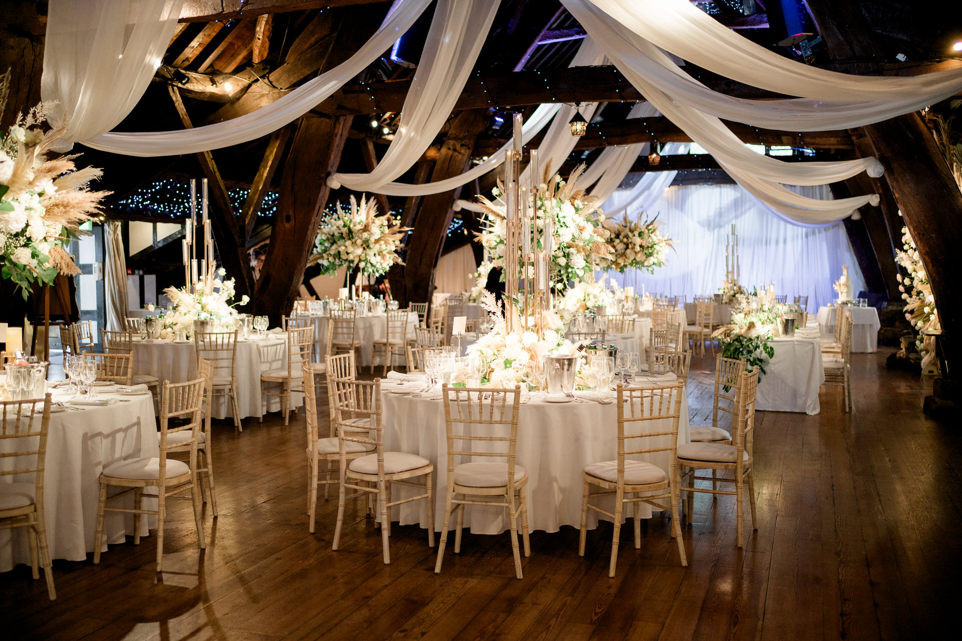 Rivington hall barn wedding, with lots of lowers and pampas by red floral