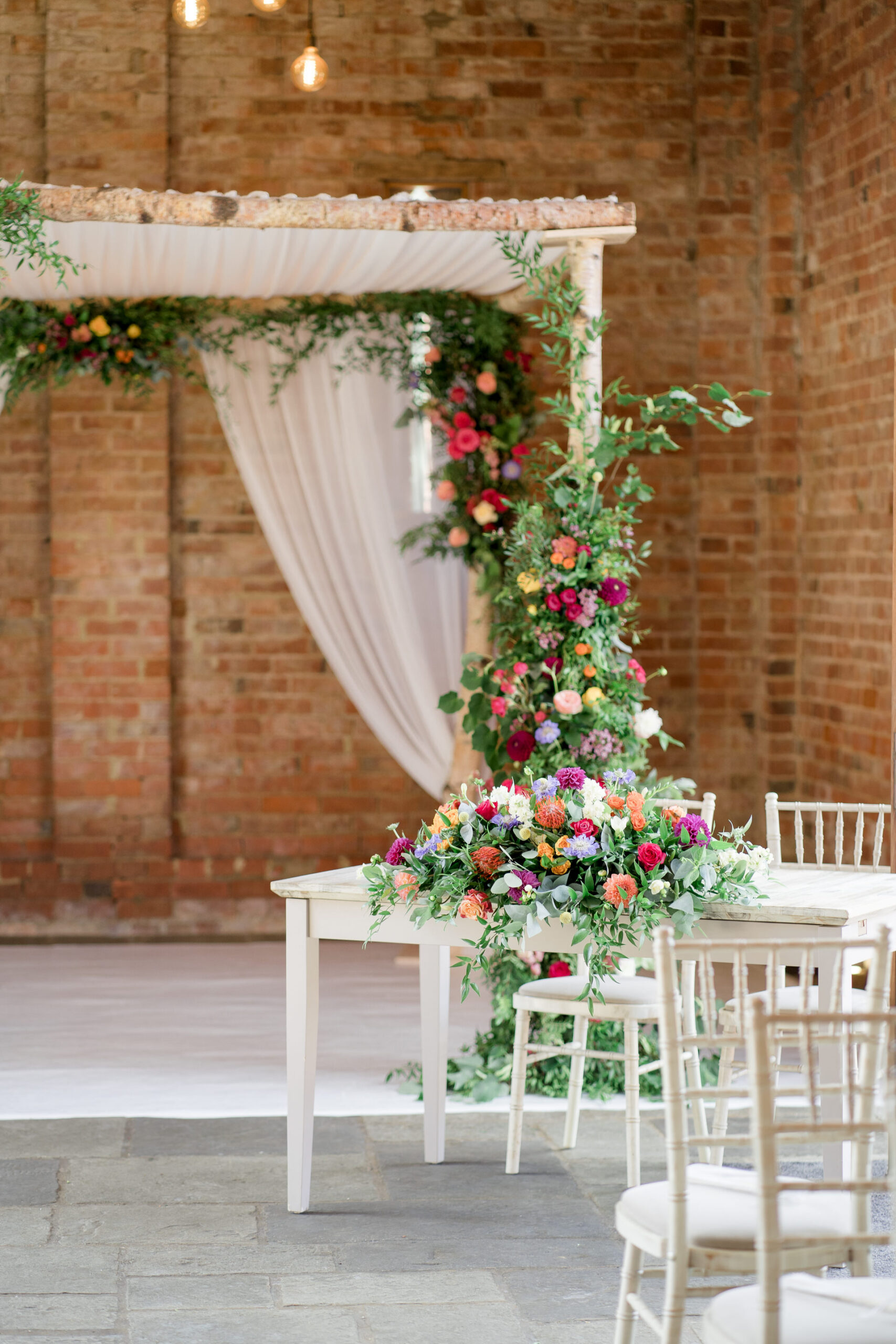 mickleton hills farm wedding ceremony with colourful flowers