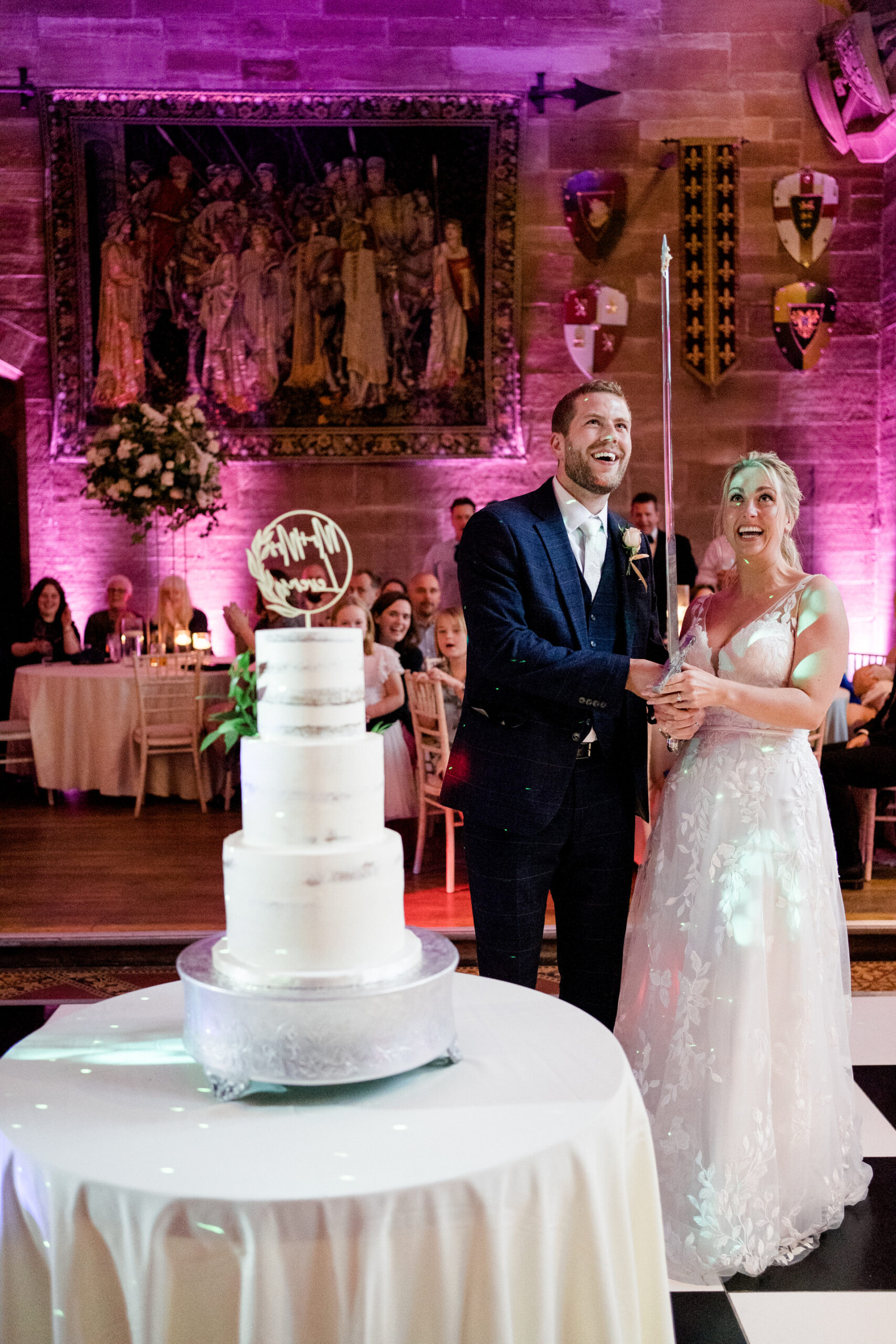 cake cutting at peckforton castle wedding