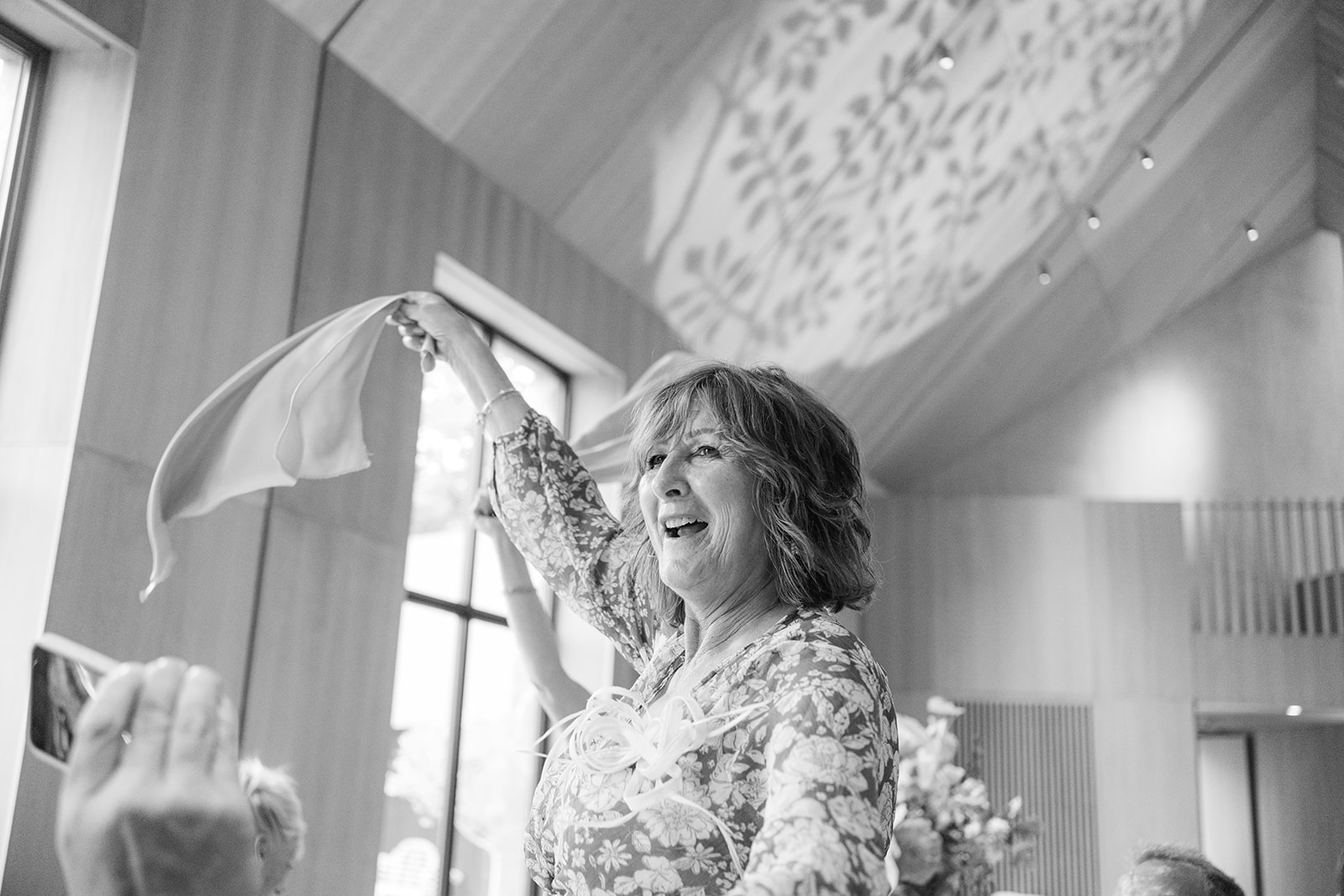 wedding guest waves her napkin