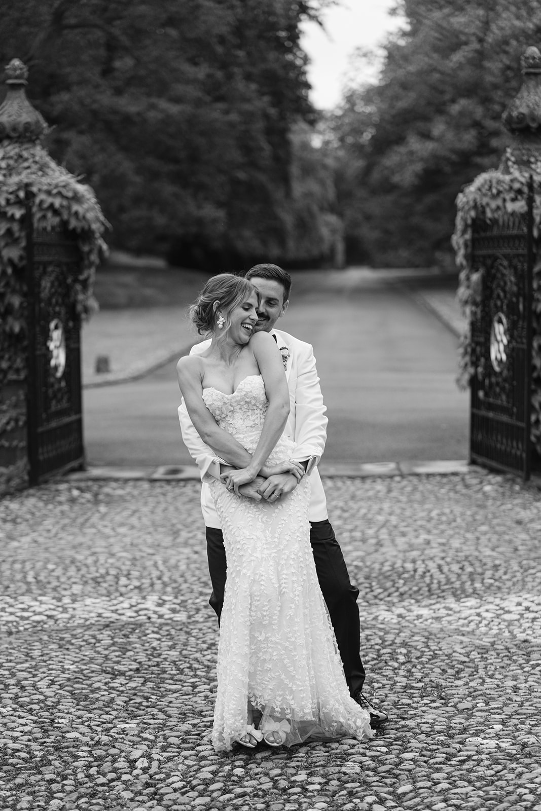 bride and groom practise first dance on the driveway of dorfold hall