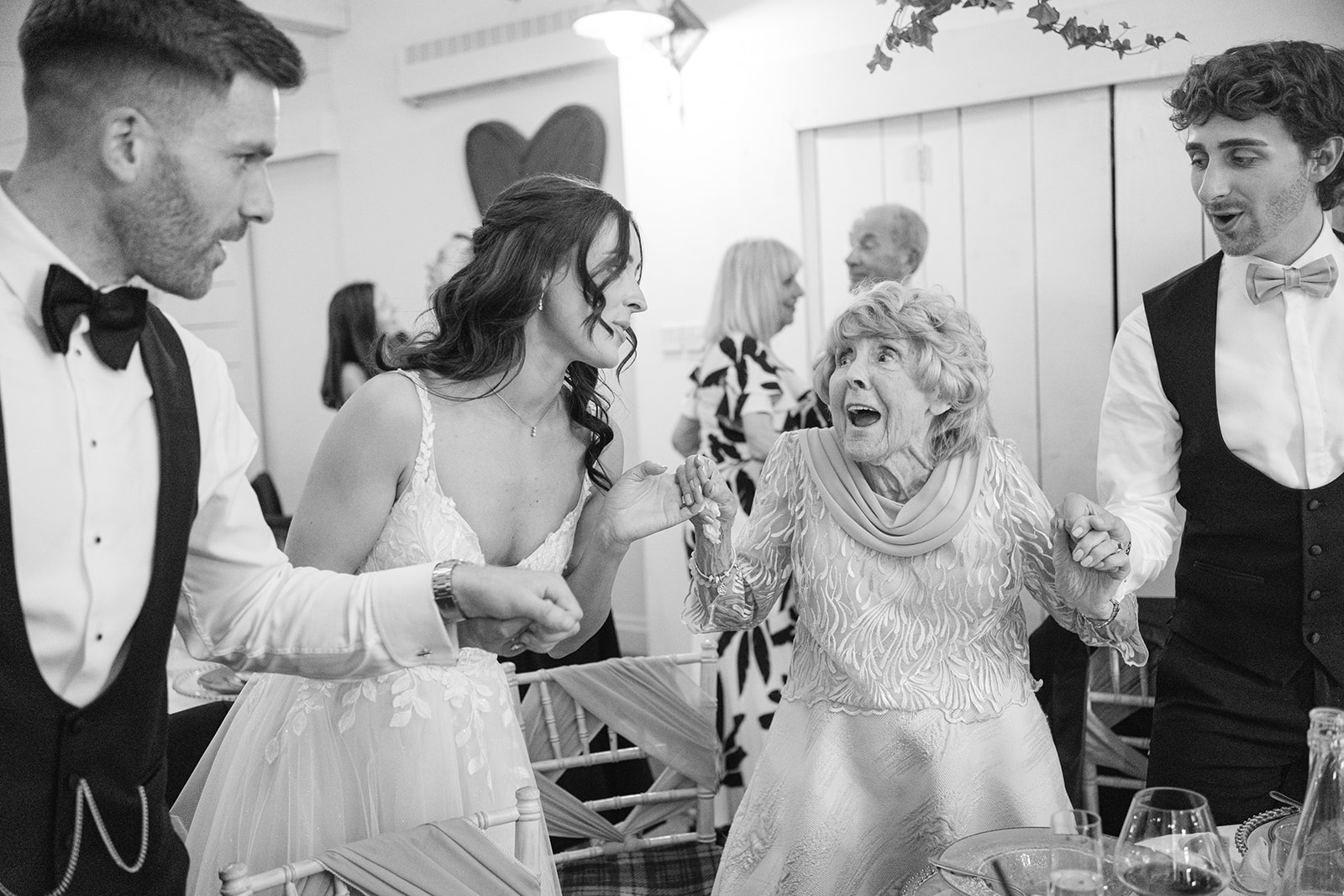 Brides Grandma sings along to singing waiters at Bashall Barn wedding
