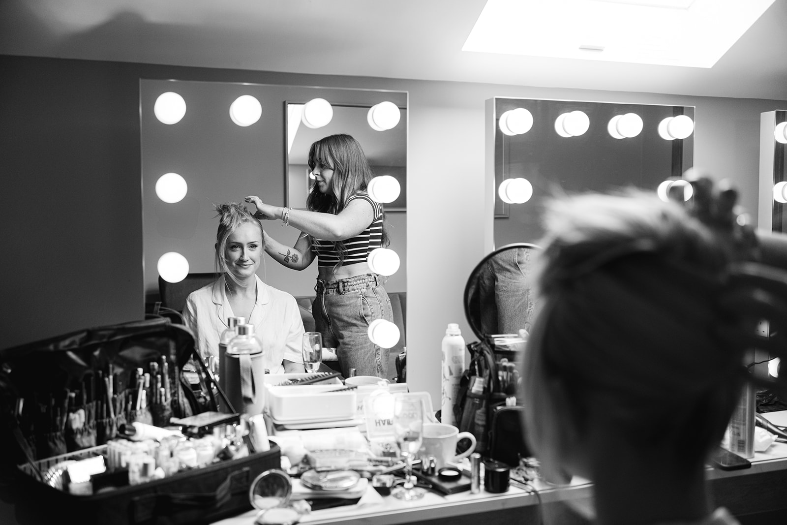 bride having hair done captured in mirror reflection at hobbit hill
