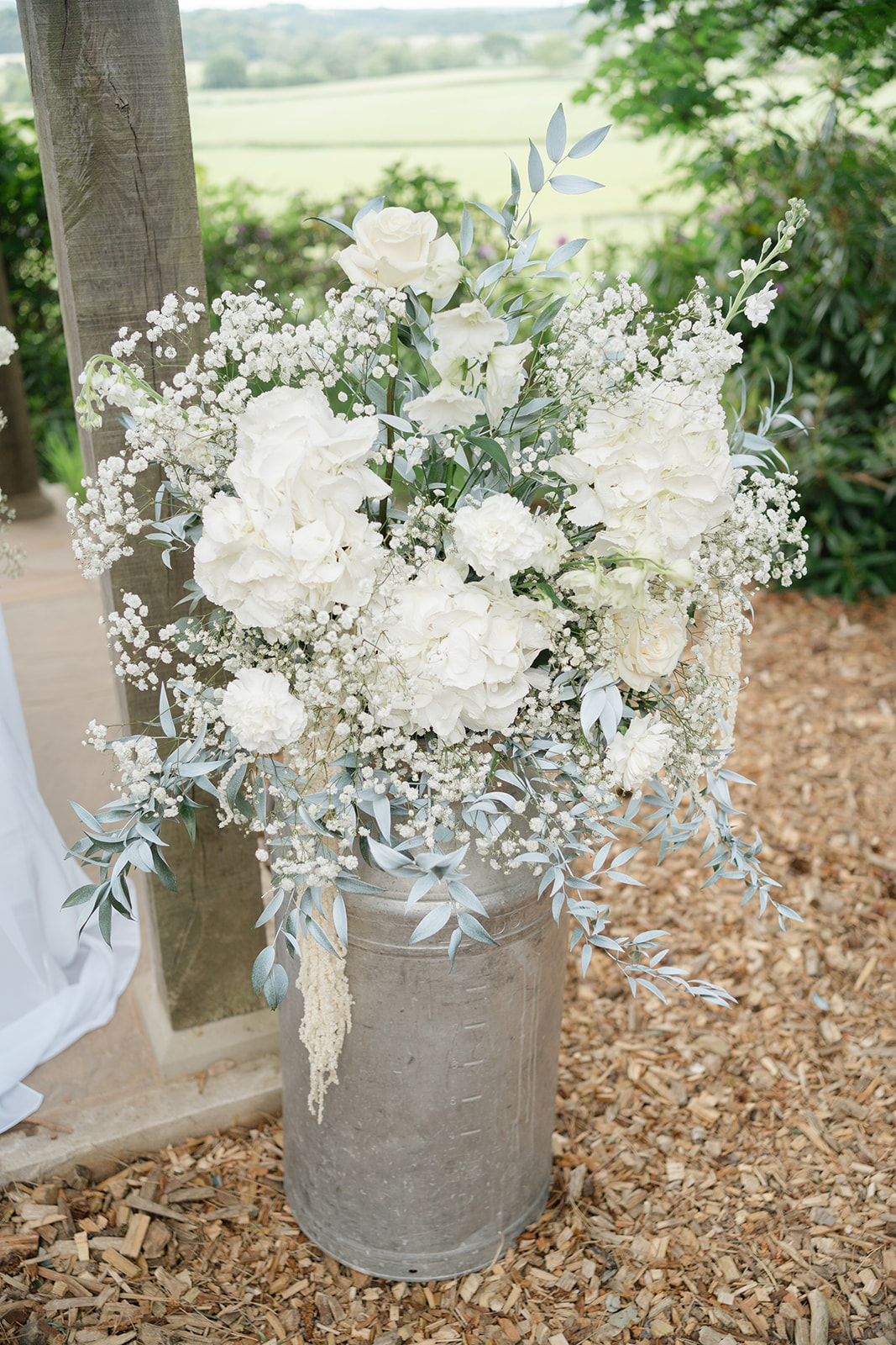 white and green flowers in urn