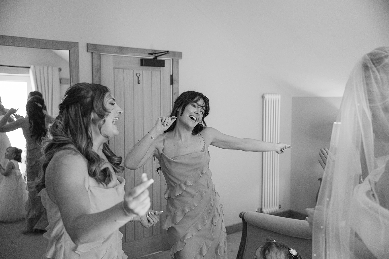 bridesmaid dancing after seeing the bride for the first time