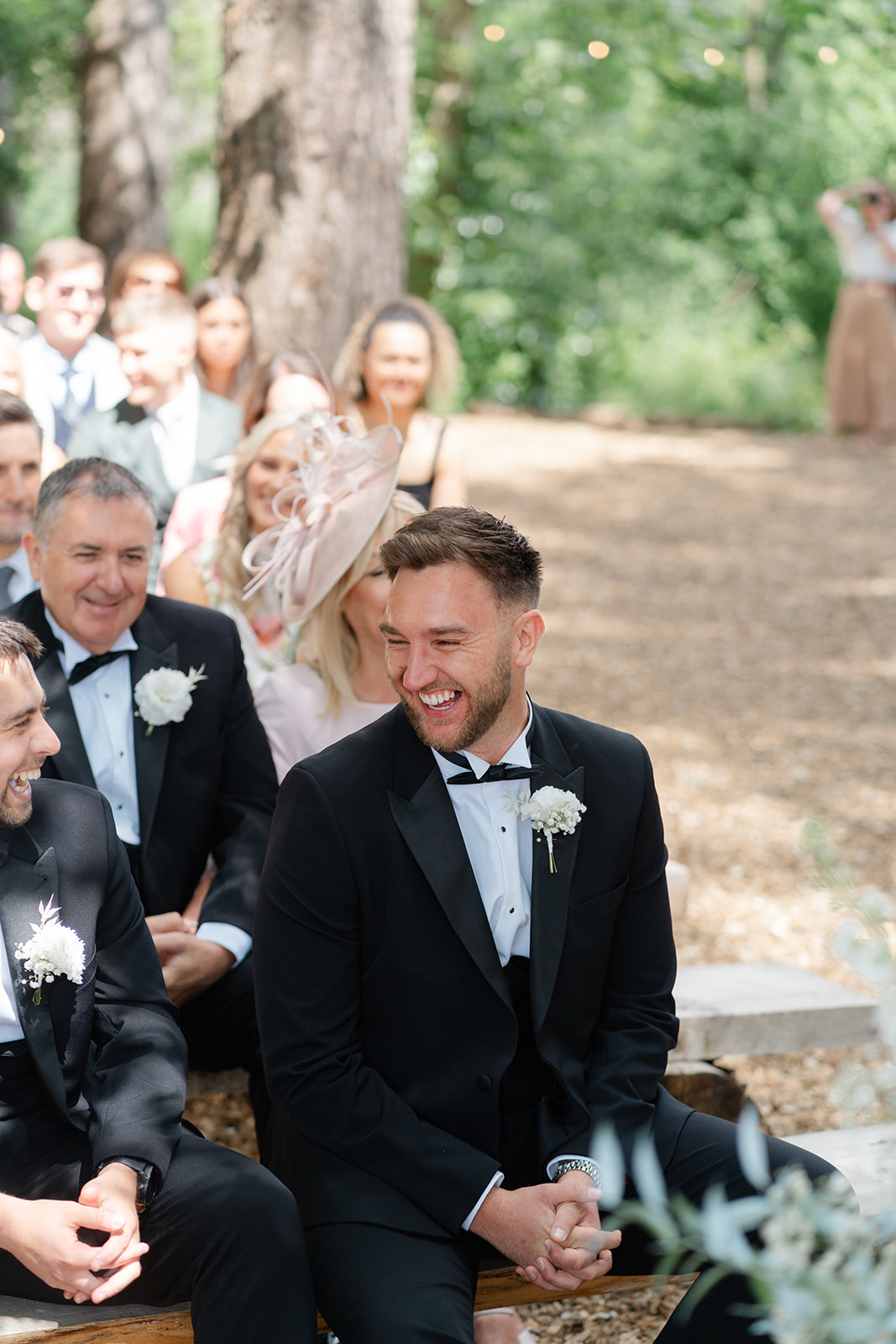 groomsman smiles during ceremony
