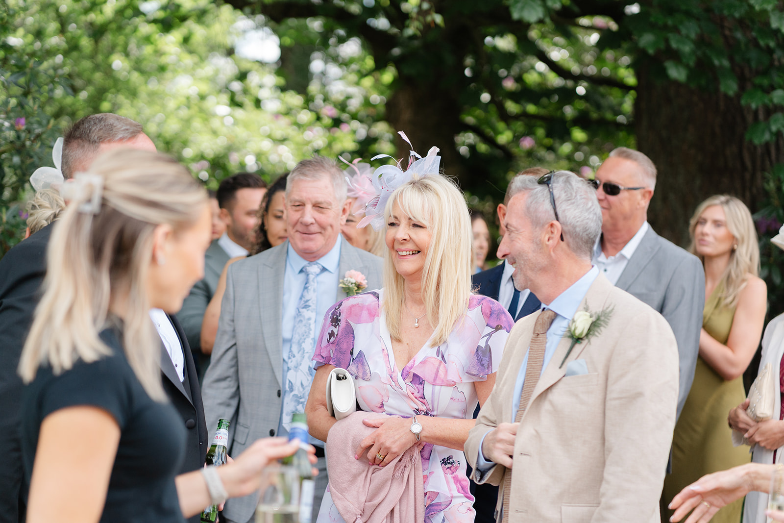 wedding guest wearing pink and purple