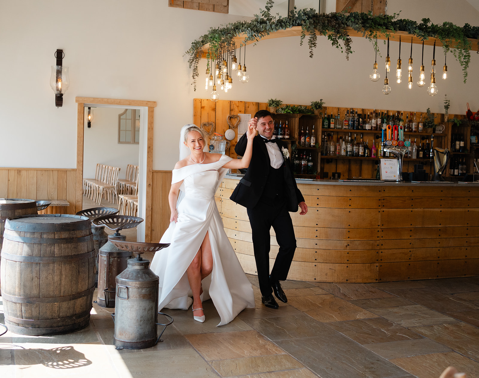 bride and groom enter wedding breakfast at hobbit hill