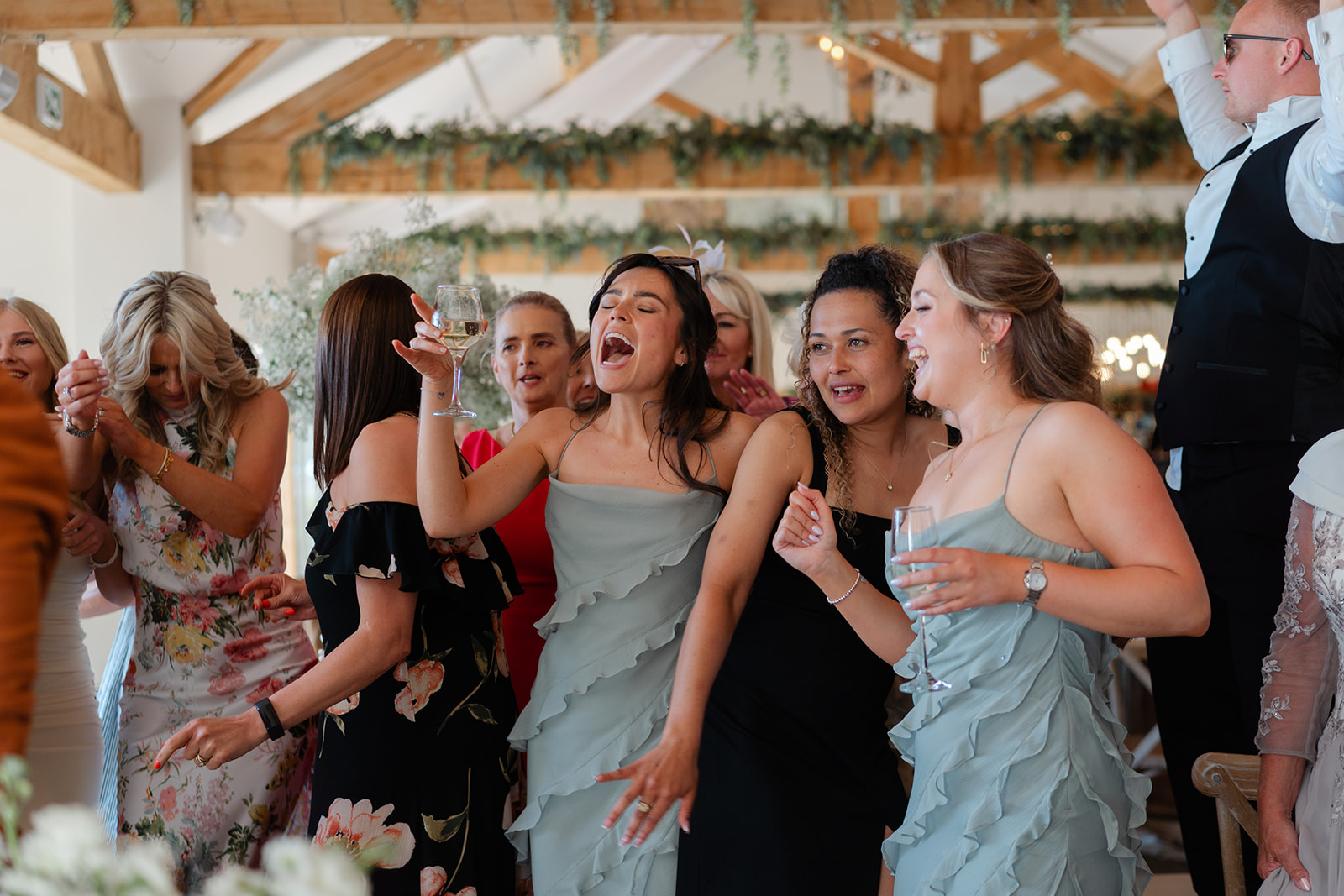 guests dancing and singing at hobbit hill wedding