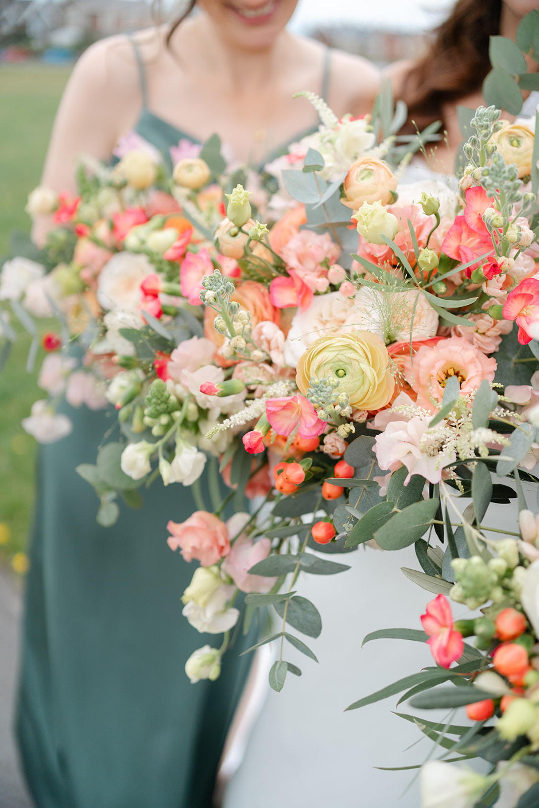 peach wedding flowers with sage green dresses