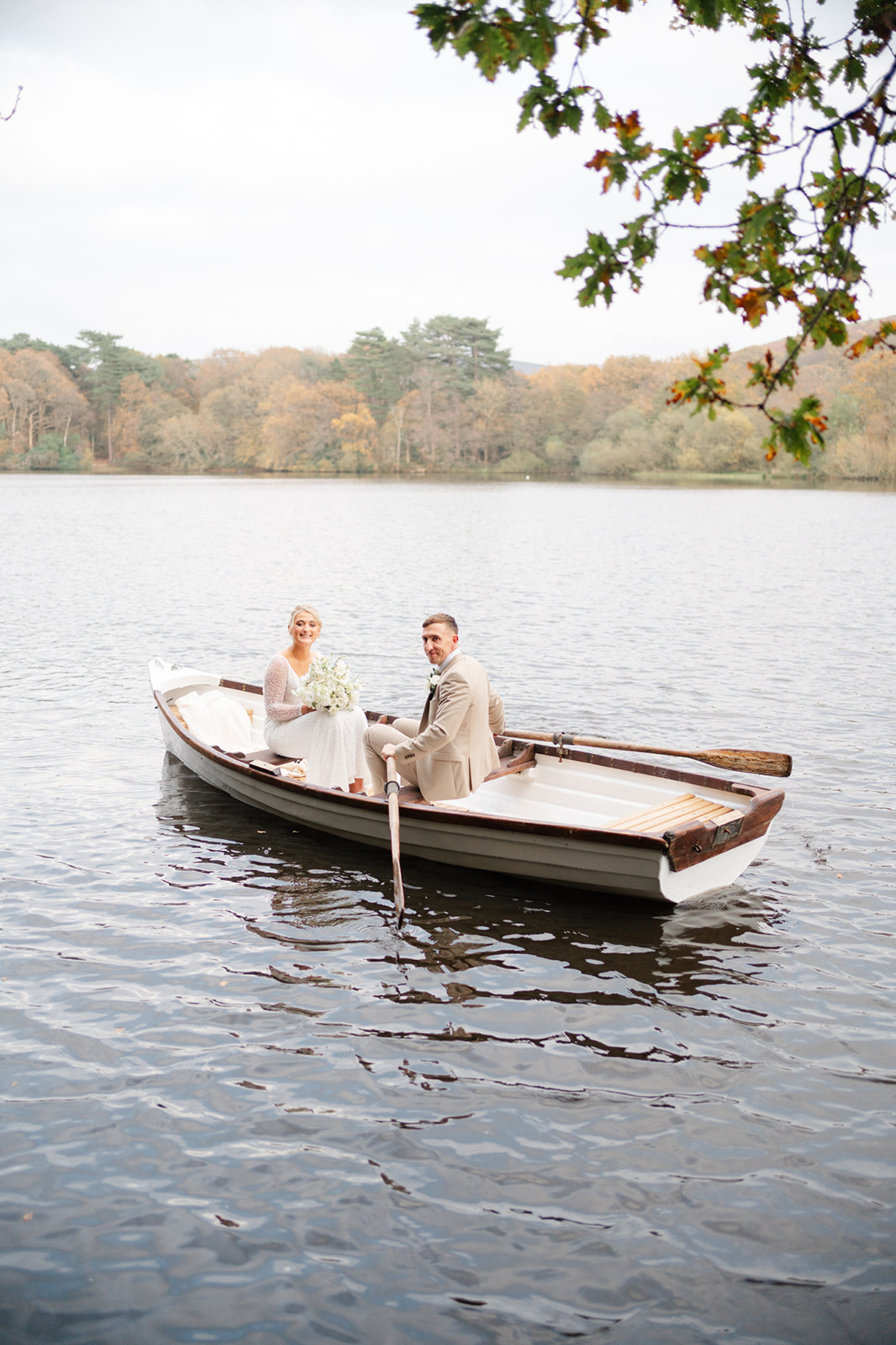 bride and groom in boat at wyresdale park wedding